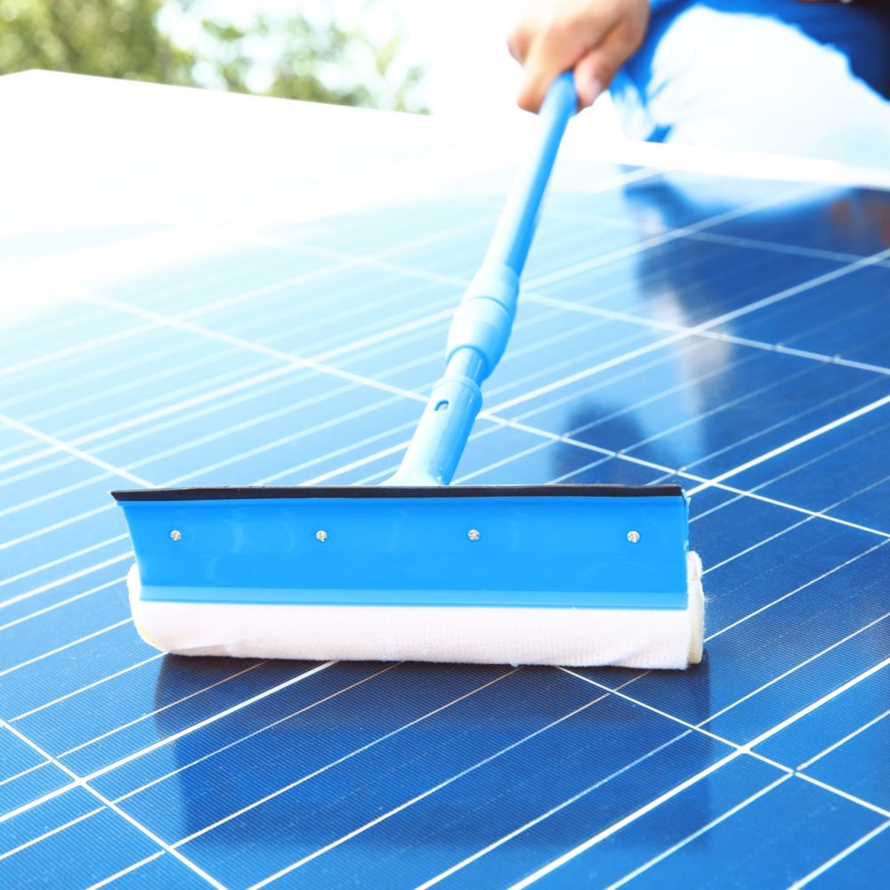 shutterstock_725011555_cleaning_solar_panels
